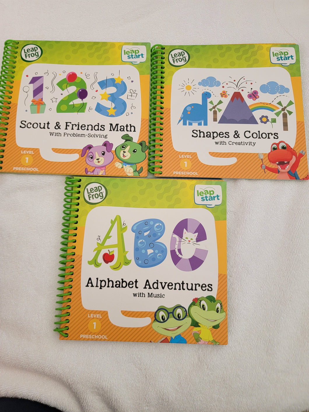 Leapstart books used onc Abc 123 color shapes