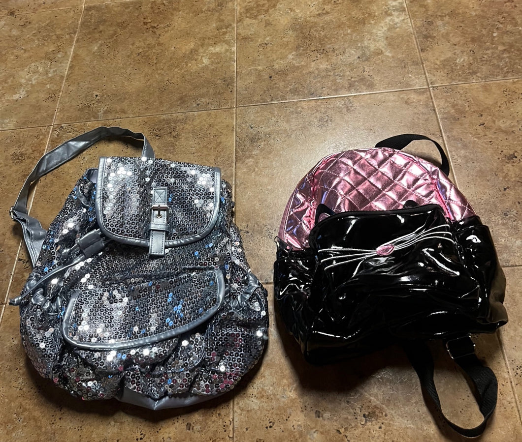 2 small bkpks-slvr Sequin & Blk/pink cat